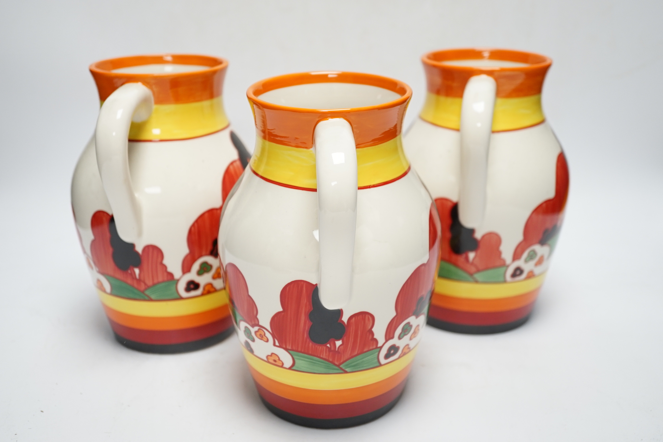 Three Wedgwood Bizarre Clarice Cliff Lotus jugs - Farmhouse pattern, limited edition with boxes and certificates, jugs 20cm high